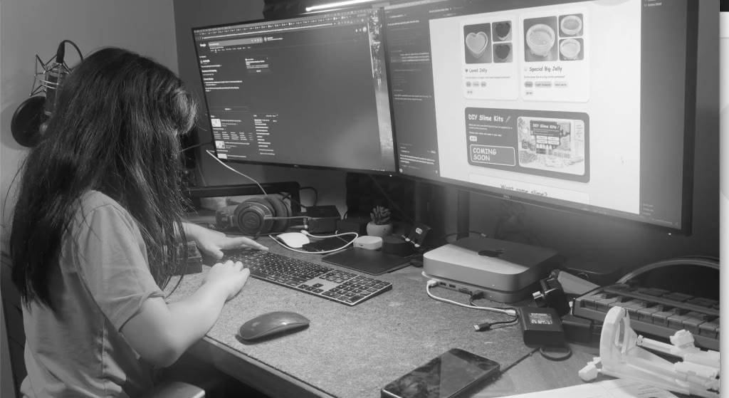 Jili working at a desk on creative projects